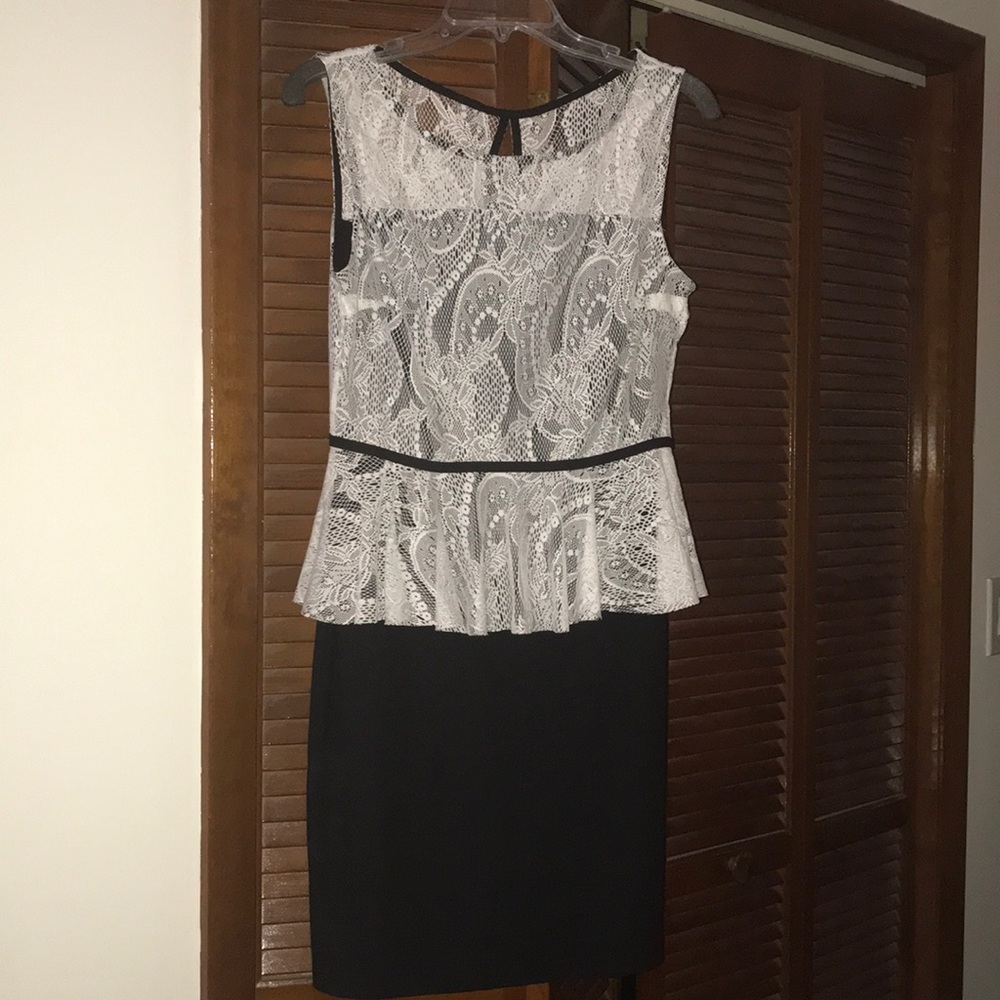 Sleeveless peplum lace top dress.